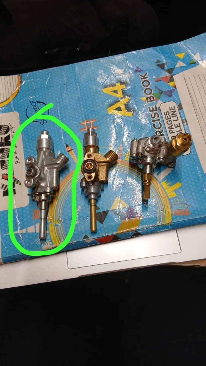 Cooker gas taps laid out, with the faulty one circled