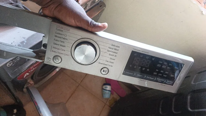 LG washing machine control panel removed for repair
