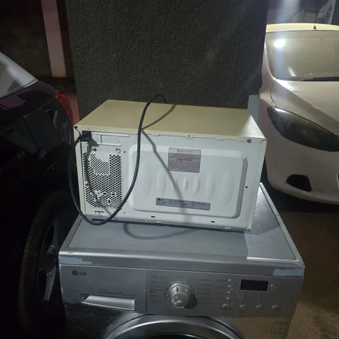 Microwave opened up on the bench during a repair