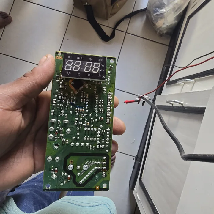 Microwave display and control board removed for repair