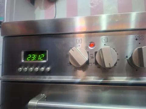Stainless range cooker control panel with clock