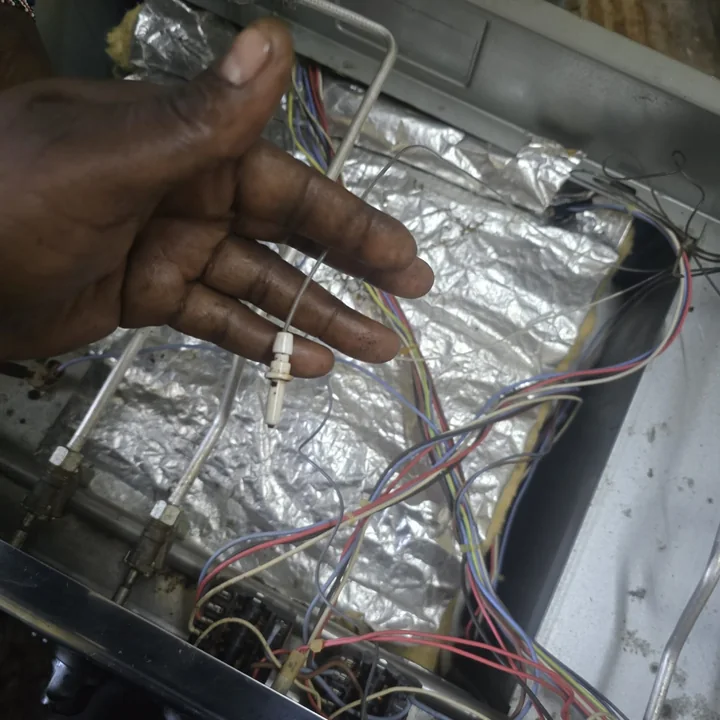 Oven wiring harness and thermal fuse behind the back panel