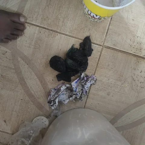 Socks and debris pulled out from inside a washing machine