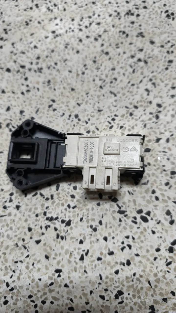 Washing machine door interlock switch removed for testing